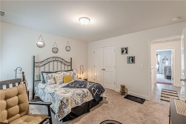 446 Vandenburg Dr, Villa Rica, GA 30180 - carpeted bedroom featuring attic access, baseboards, and a closet