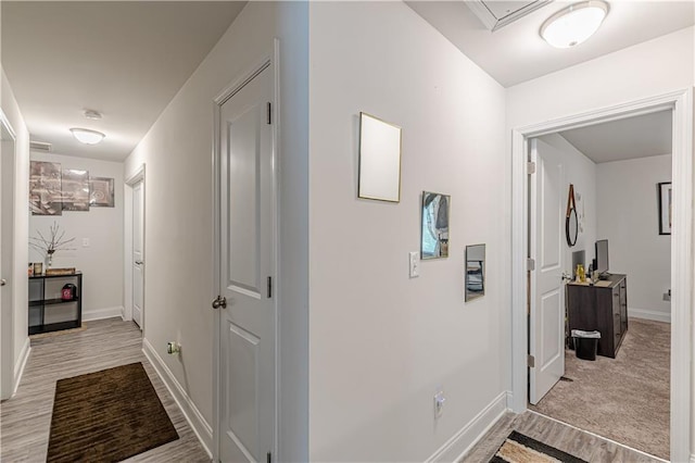 446 Vandenburg Dr, Villa Rica, GA 30180 - hallway with baseboards and light wood-type flooring