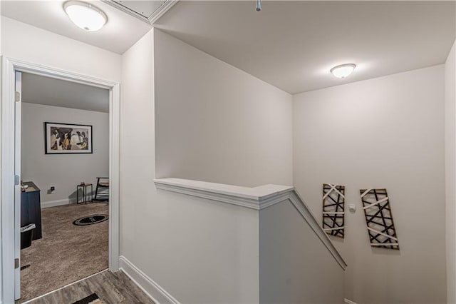 446 Vandenburg Dr, Villa Rica, GA 30180 - hall featuring an upstairs landing, wood finished floors, and baseboards