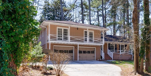 exterior space featuring french doors, a porch, and concrete driveway