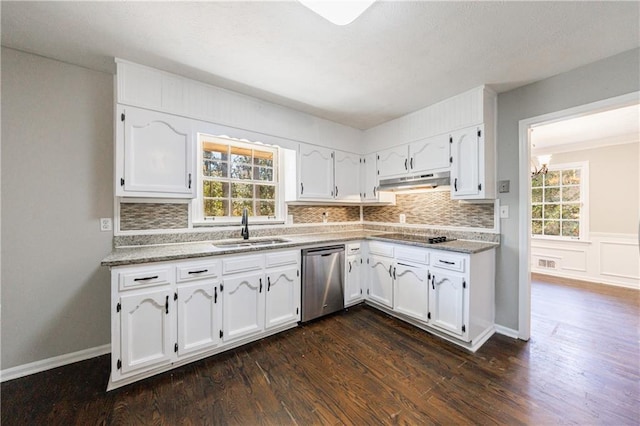 kitchen featuring under cabinet range hood, a sink, white cabinetry, and stainless steel dishwasher