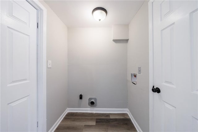 laundry area featuring laundry area, hookup for a washing machine, wood finished floors, and baseboards