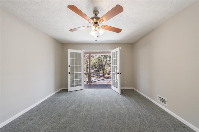 unfurnished room with french doors, baseboards, carpet, and a textured ceiling