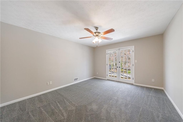 spare room featuring visible vents, french doors, carpet, and baseboards