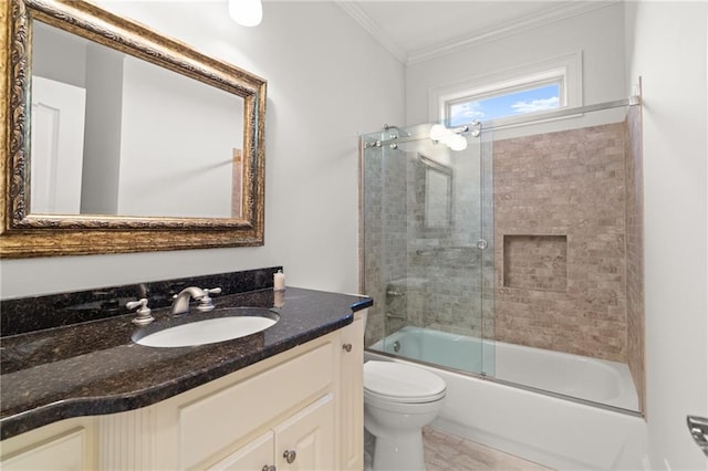 full bathroom featuring vanity, toilet, ornamental molding, and enclosed tub / shower combo