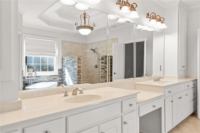 bathroom with vanity, ornamental molding, and independent shower and bath