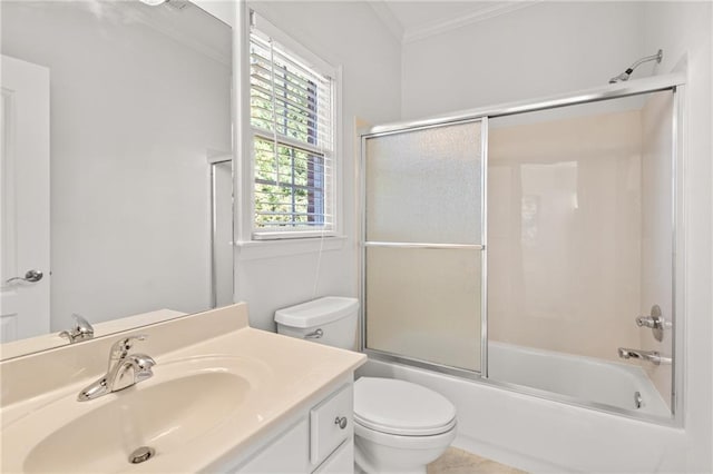 full bathroom with vanity, crown molding, combined bath / shower with glass door, and toilet