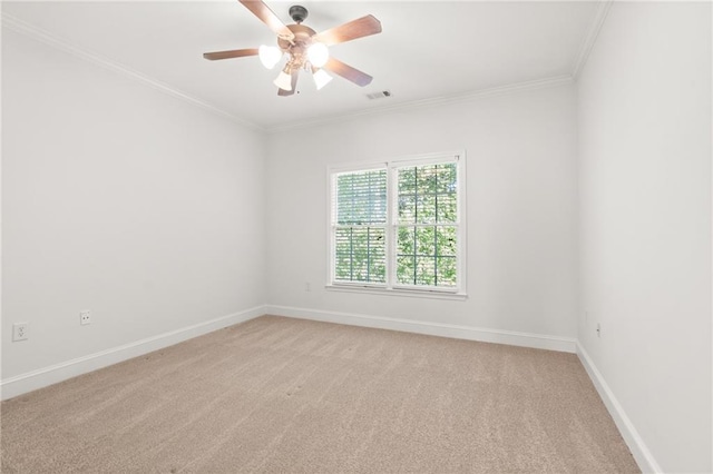 carpeted empty room with crown molding and ceiling fan