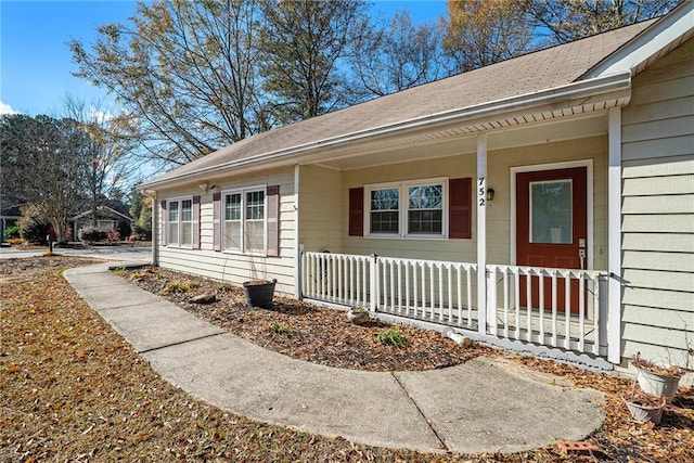 doorway to property featuring a porch