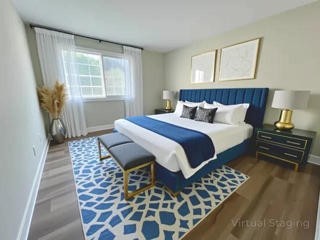 405 Fairburn Rd SW Unit 231, Atlanta, GA 30331 - bedroom featuring baseboards and wood finished floors