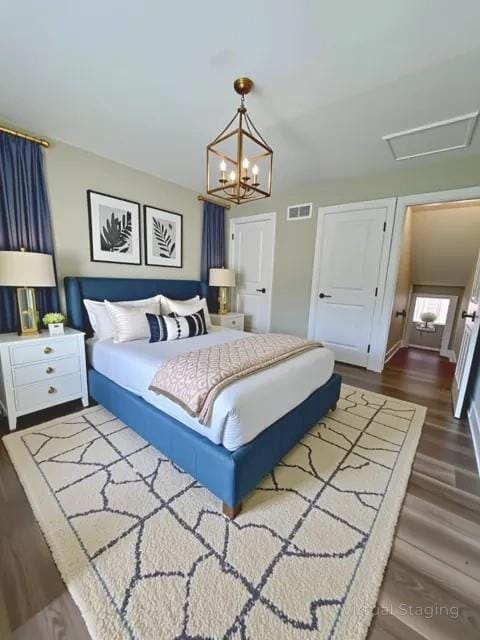 405 Fairburn Rd SW Unit 231, Atlanta, GA 30331 - bedroom with dark wood-type flooring and a chandelier