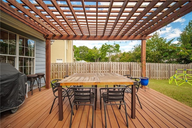 deck with grilling area, fence, a yard, a pergola, and outdoor dining space