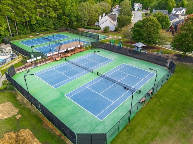 view of tennis court with fence