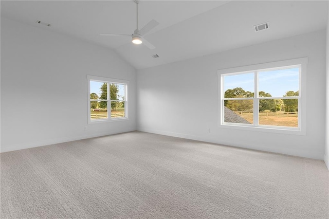 unfurnished room with carpet, ceiling fan, and a wealth of natural light