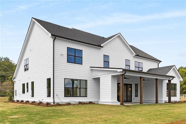 view of front facade with a front yard, a patio, and ceiling fan