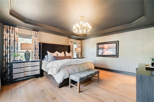 bedroom with crown molding, a chandelier, a raised ceiling, and wood finished floors