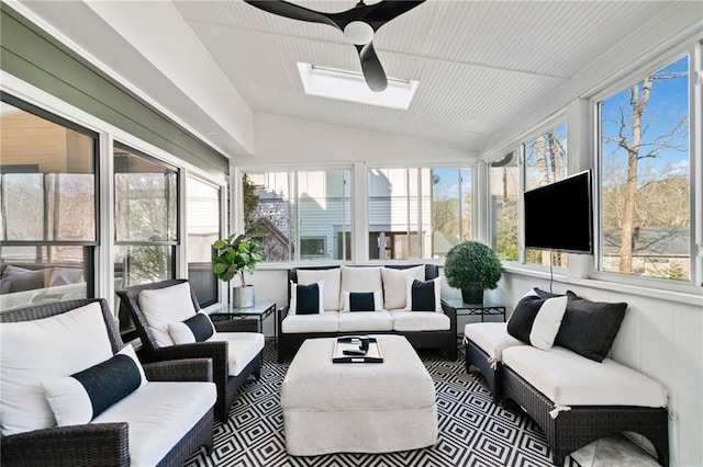 sunroom / solarium featuring plenty of natural light and vaulted ceiling with skylight