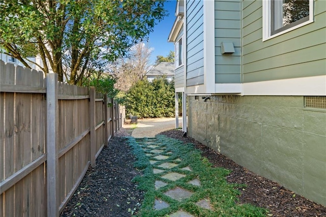 view of home's exterior featuring fence