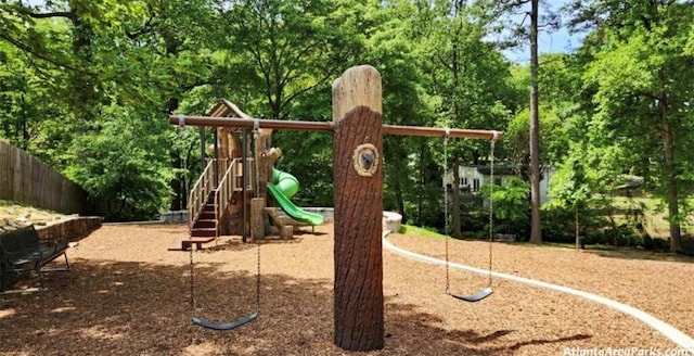 communal playground featuring fence