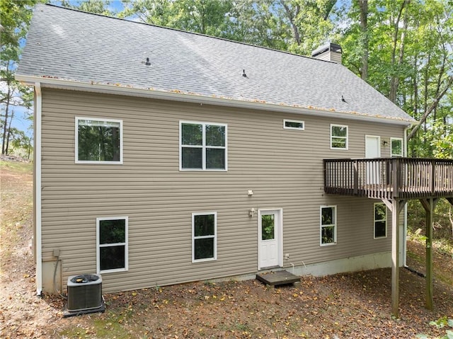 back of property with a wooden deck and central air condition unit