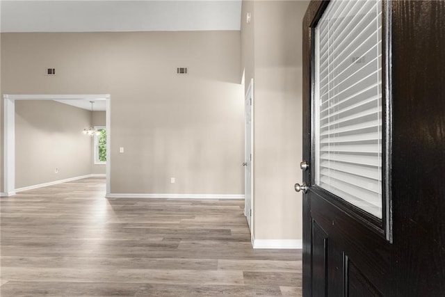 entryway with a chandelier and light hardwood / wood-style floors