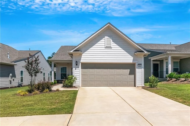 view of front of home featuring a garage, concrete driveway, and a front lawn