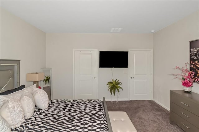 carpeted bedroom with baseboards