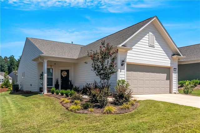 ranch-style house featuring an attached garage, driveway, a shingled roof, and a front yard