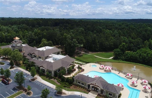 drone / aerial view featuring a forest view