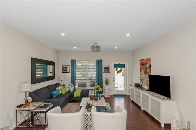 living area featuring dark wood-type flooring and recessed lighting