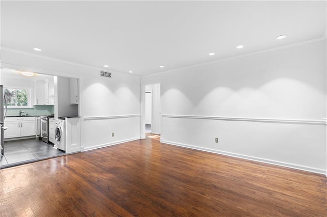 living room with crown molding and hardwood / wood-style floors