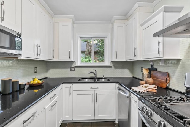 kitchen featuring white cabinetry, sink, and appliances with stainless steel finishes