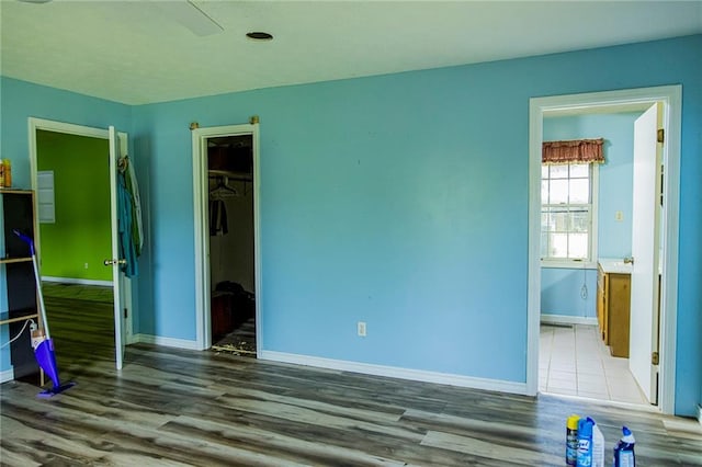 83 Manning Lake Rd, Rome, GA 30165 - unfurnished bedroom with wood finished floors and connected bathroom