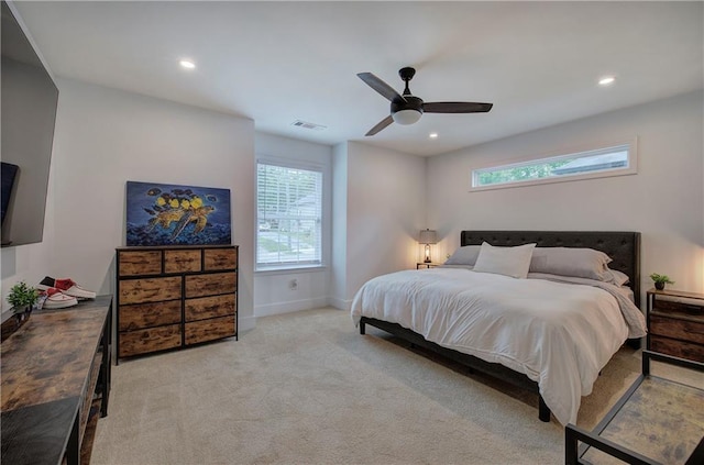 bedroom with recessed lighting, light colored carpet, visible vents, a ceiling fan, and baseboards