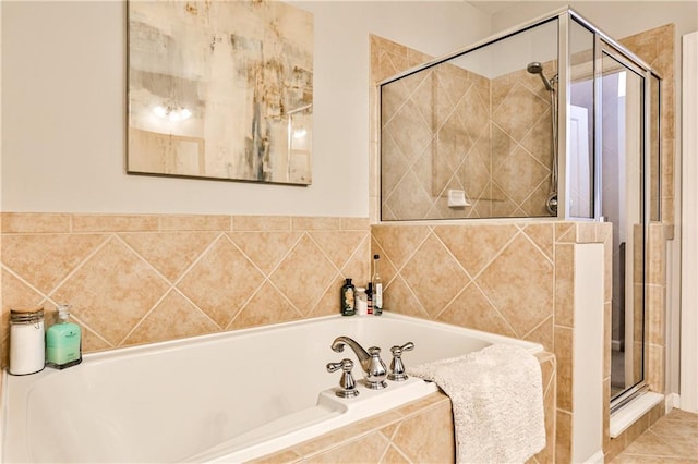full bath with a garden tub and a shower stall