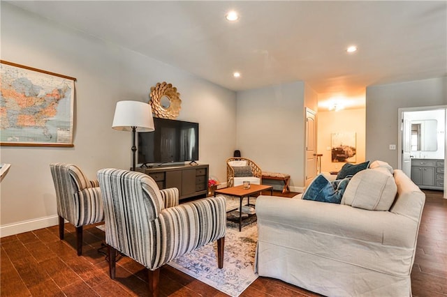 living area featuring baseboards, recessed lighting, and dark wood-style floors