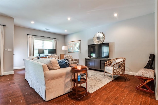 living room with baseboards, recessed lighting, dark wood-type flooring, and visible vents