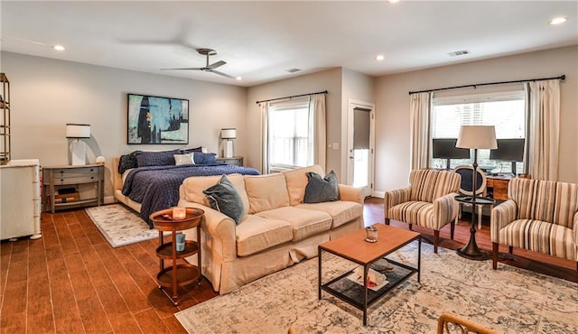 bedroom featuring dark wood-type flooring, recessed lighting, a ceiling fan, and visible vents