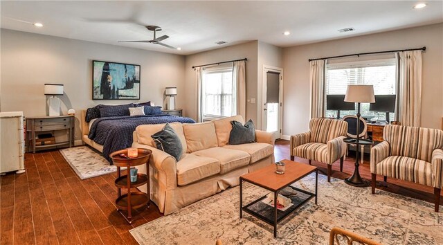 bedroom with recessed lighting, ceiling fan, visible vents, and dark wood finished floors