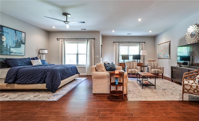 bedroom with ceiling fan, visible vents, baseboards, recessed lighting, and dark wood-type flooring