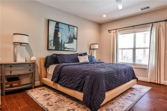 bedroom with recessed lighting, baseboards, visible vents, and dark wood finished floors