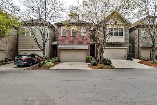 view of front of house with concrete driveway, brick siding, and a garage