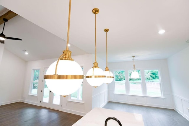 interior details featuring a decorative wall, wood finished floors, and wainscoting