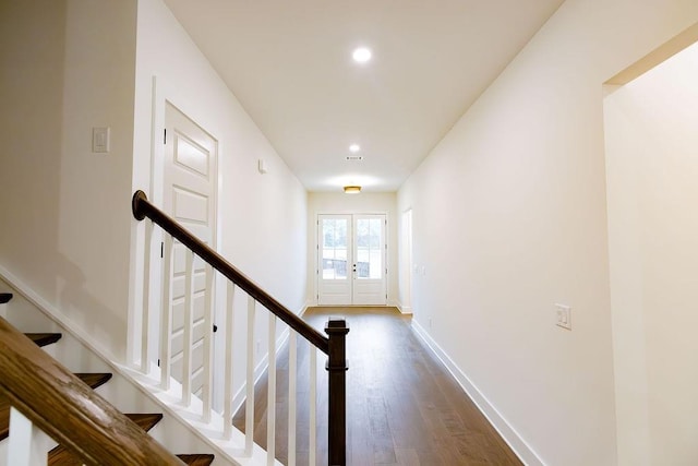 interior space featuring recessed lighting, baseboards, wood finished floors, and french doors