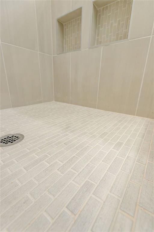 room details with a tile shower