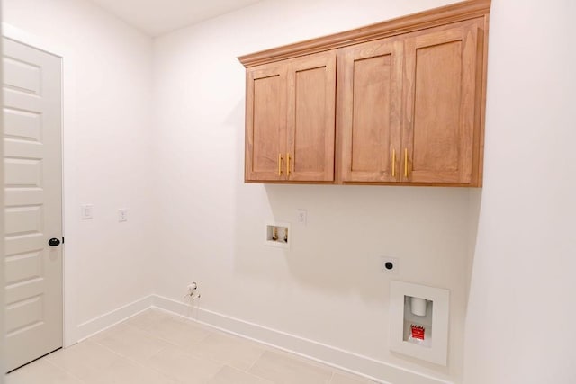 laundry room with cabinet space, baseboards, gas dryer hookup, hookup for a washing machine, and electric dryer hookup