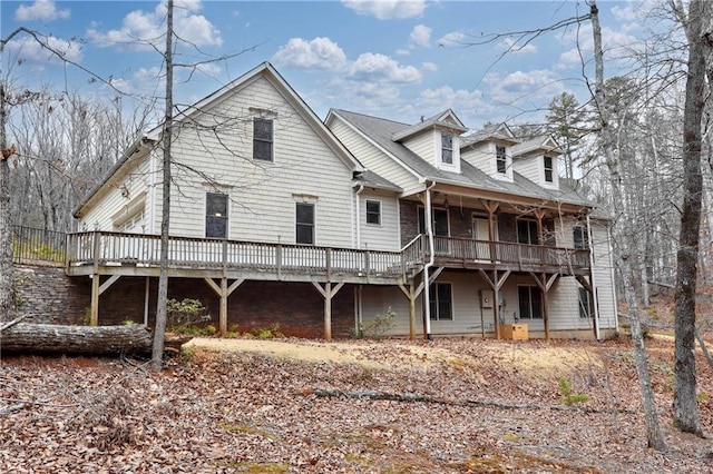 back of property featuring a deck