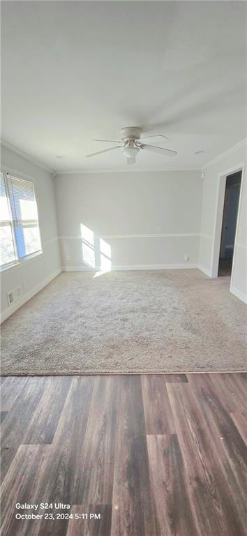 spare room featuring hardwood / wood-style flooring, ceiling fan, and ornamental molding