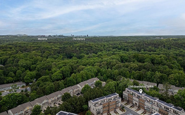 birds eye view of property with a wooded view