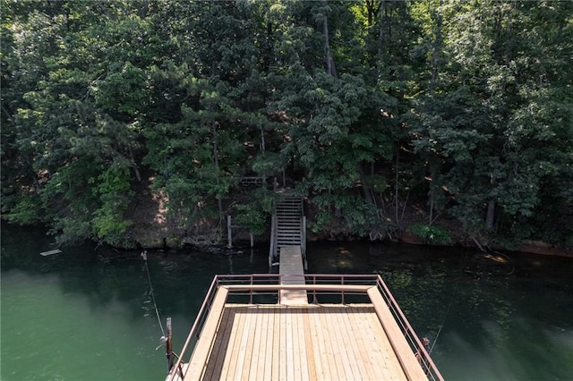 view of dock with stairway and a water view